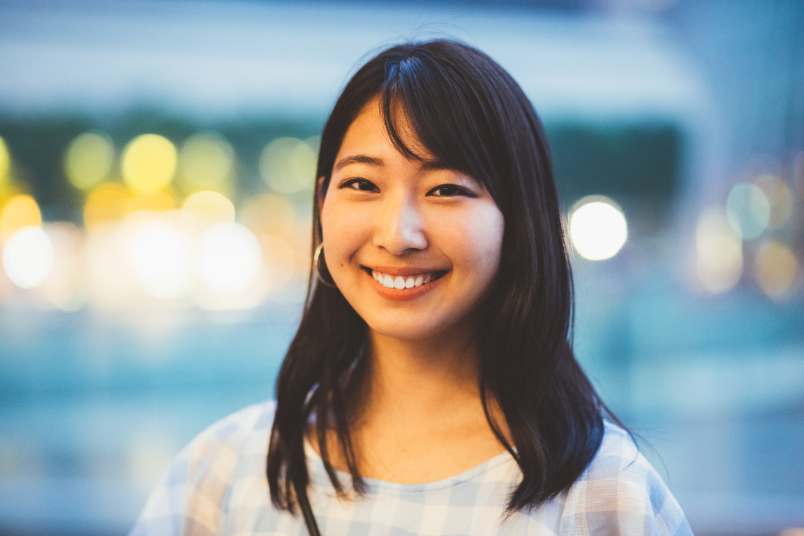 Smiling japanese woman looking at camera
