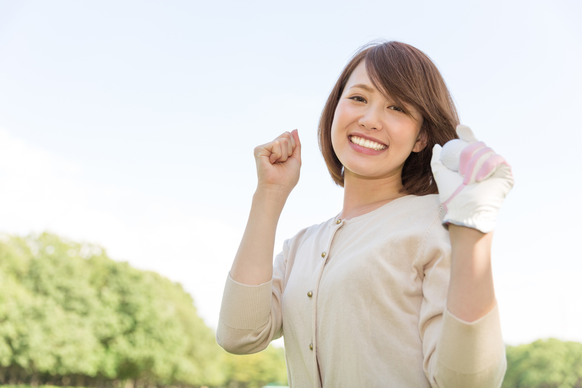 Japanese woman playing golf